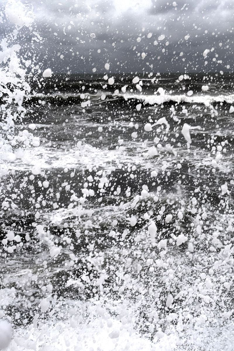 Angry ocean waves crash and slosh to and fro