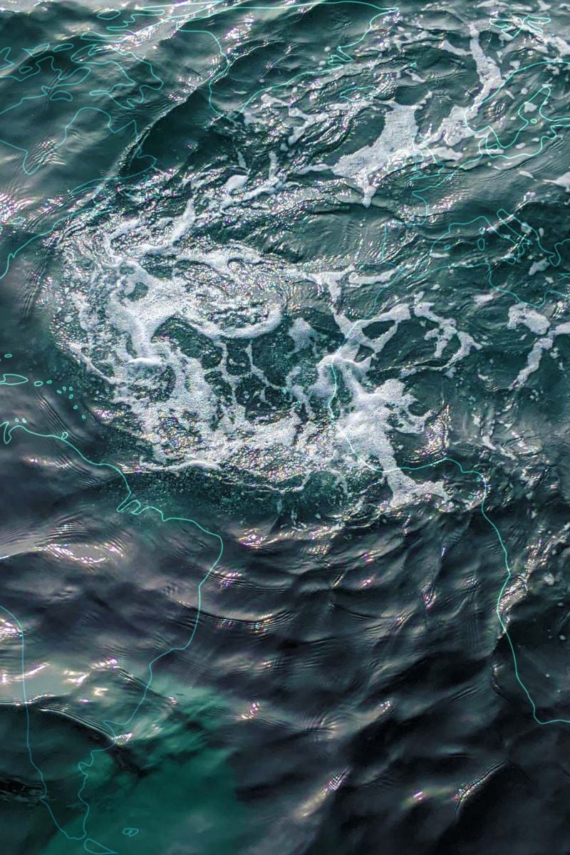 Ocean waters with world map outline