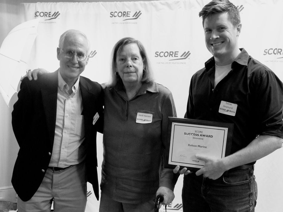 Toby Dewhurst, Kelson's CEO, accepting the 2023 SCORE Award for Best Innovative Small Business